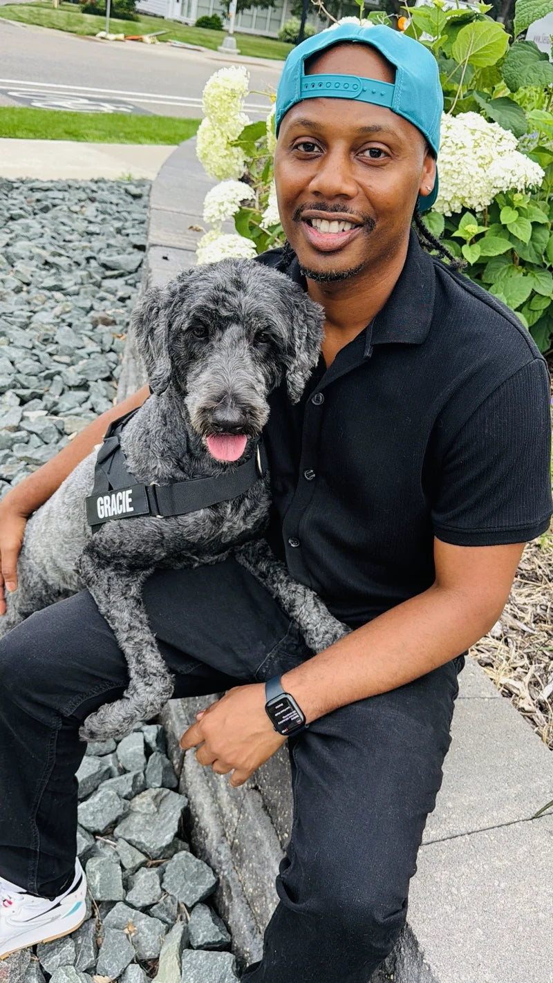 Owner and dog in a DFC harness outdoors