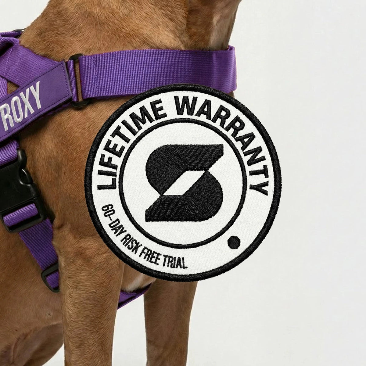 Lifetime Warranty, 60-day risk free trial badge over a dog wearing the Indigo harness